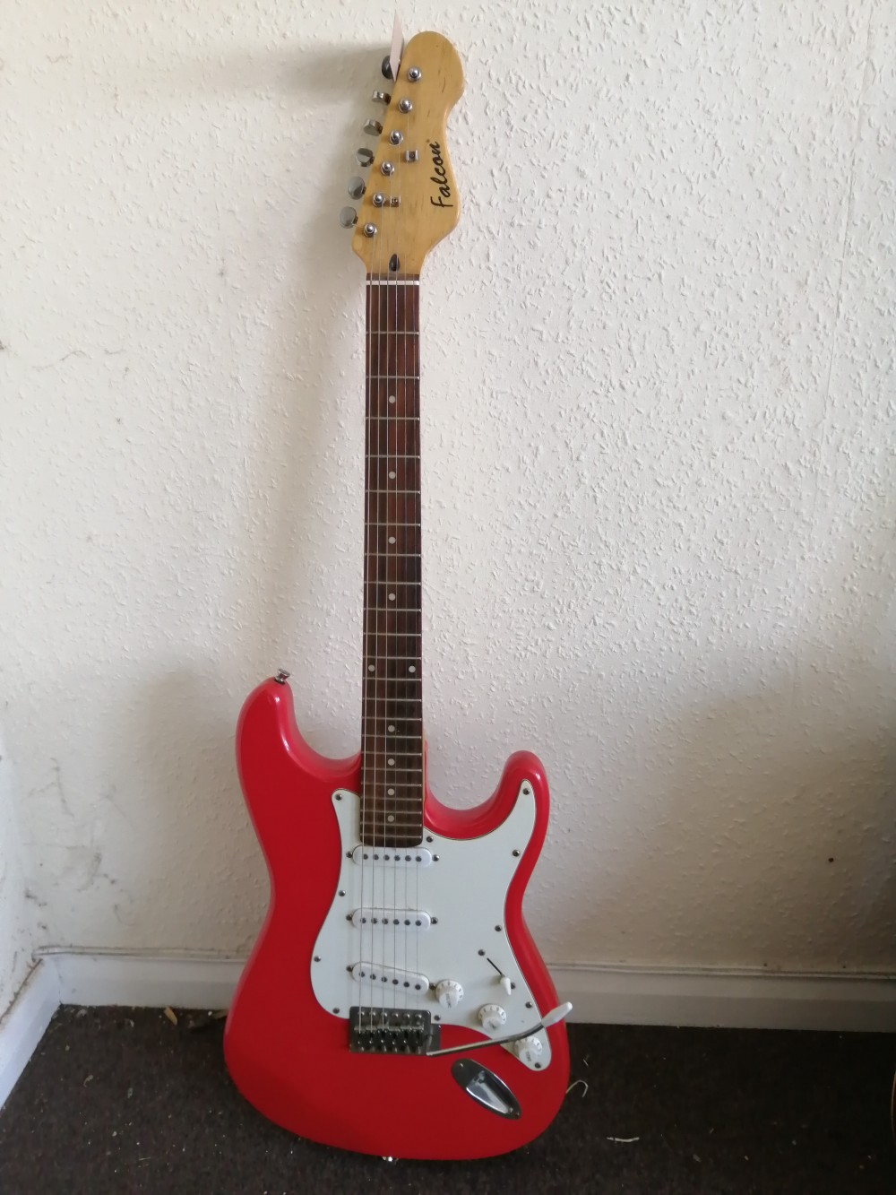 A Falcon Strat-style electric guitar